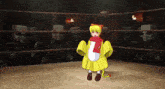 a cartoon character is standing in a boxing ring with a scarf around her neck