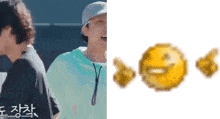 a man is laughing next to a pixelated smiley face .