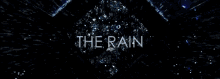 a black background with the word the rain written on it