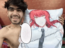 a shirtless man is holding a pillow with a picture of a red haired girl on it