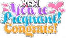 a sign that says desi you 're pregnant congrats on it