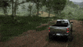 a ram truck driving down a dirt road