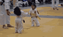Hug Fight GIF - Hug Karate Kids GIFs