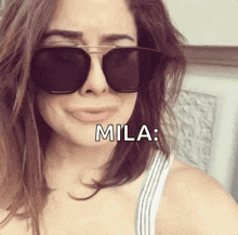a woman wearing sunglasses with the name mila written on her face