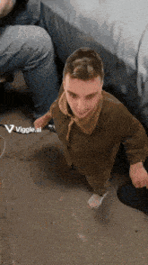 a picture of a man with the word viggle.ai on the bottom left