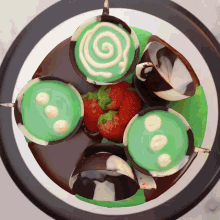 a chocolate cake with green frosting and strawberries