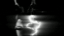 a blurry picture of a person standing in front of a glass door .