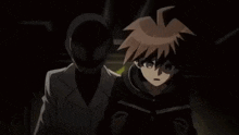 a boy is standing next to a man in a mask .
