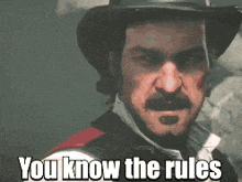 a man with a hat and a mustache says " you know the rules "