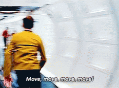 chekov running down a white hallway quickly and saying move move move