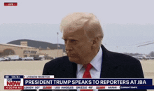 president trump speaks to reporters at jba on the news