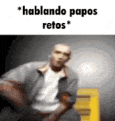 a blurry picture of a man with the words " hablando papos retos " on the top