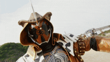 a person wearing a cowboy hat and a mask with a sword in their hand
