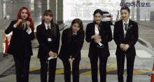 a group of women wearing suits and ties are standing next to each other with the words honeycam.org in the upper left corner