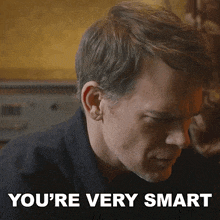 a close up of a man 's face with the words you 're very smart above him
