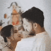 a man and a woman are kissing each other .