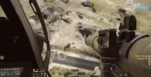 a person is playing a video game with a sniper rifle .