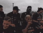 a group of men wearing black shirts with the word api on them