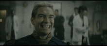 a man is laughing with his mouth open and his tongue hanging out