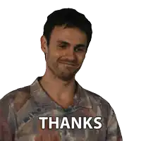 a man wearing a shirt that has the word thanks on it