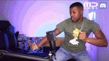 a man in a green shirt is dancing in front of a sign that says " md soul "