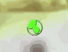 a green cartoon character is holding two guns in his hands and pointing at the camera .
