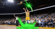 a basketball player in a yellow jersey with the number 30 on it is jumping in the air