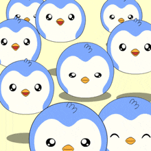 a bunch of blue and white penguins with a yellow beak