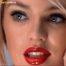 a close up of a woman 's face with a betsmove logo on the bottom