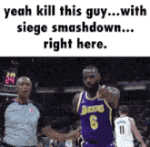 a basketball player wearing a lakers jersey is pointing at a referee