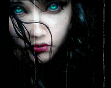 a close up of a girl 's face with green eyes
