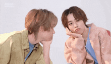 two young men are looking at each other with the word ahop on the bottom