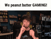 a man eating a peanut butter sandwich with the words we peanut butter gaming