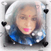 a woman with a red dot on her forehead is in a circle surrounded by hearts