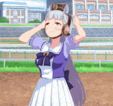 a girl in a purple and white dress adjusts her ear muffs
