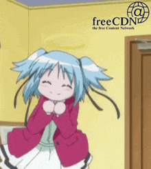 a girl with blue hair is dancing in front of a sign that says freecdn the free content network