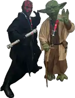 two people dressed as darth maul and yoda are posing for a picture