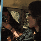 a woman is taking a picture of another woman with a camera