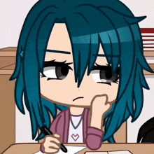 a girl with blue hair sitting at a desk with a pen in her hand