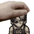 a hand is touching a pixelated image of a person 's head .