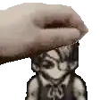 a hand is touching a pixelated image of a person 's head .