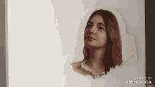 a painting of a woman 's face is made by animatica