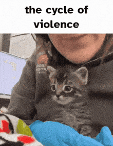 a woman is holding a kitten with the caption the cycle of violence on the bottom