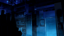 a dark room with a sign that says ' coca-cola ' on it