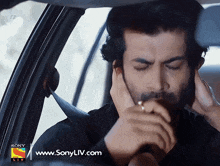 a man in a car with a sony liv logo on the bottom right
