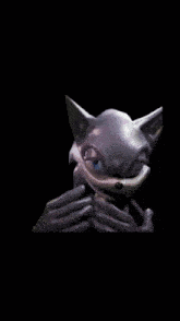 a close up of a cartoon character 's face against a black background