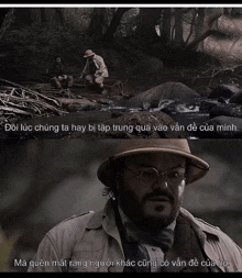 a man in a hat and glasses is talking to another man in a river