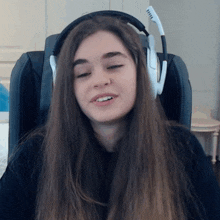 a woman wearing headphones with the letter v on the side