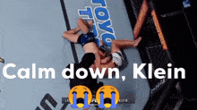 a boxing match with the words calm down klein on the bottom