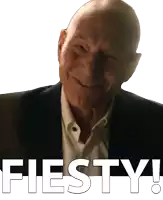 a man in a suit and white shirt is smiling with the words fiesta written below him